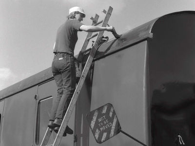 Denise Mogg at work on the roof of Mk 1 coach. 7th Sept 1985.
